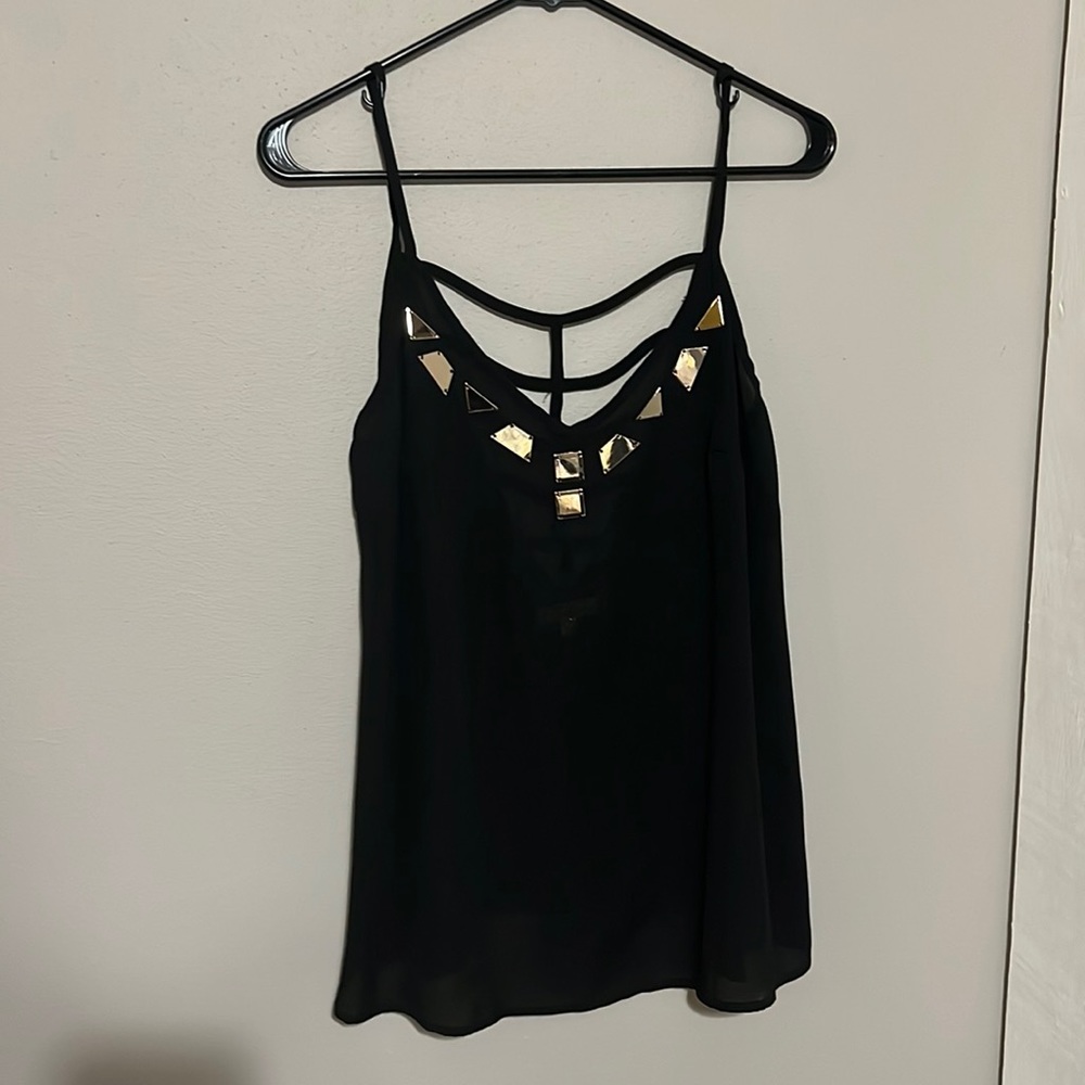Black chiffon tank with gold accessories